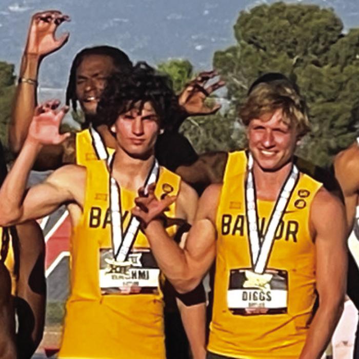 Austen Diggs, second from right, at the Big 12 championships.