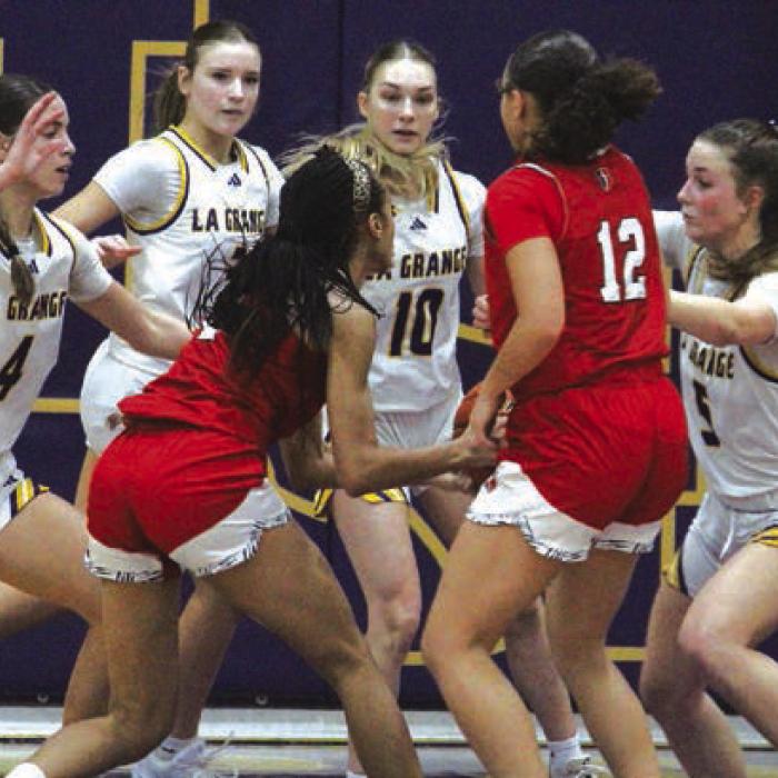 Left to right, La Grange’s Macie Collier, Avery Griffin, Kylie Trlicek and Campbell Cooper converge on this Cornerstone drive to the basket in Friday’s game. Photo by Jeff Wick