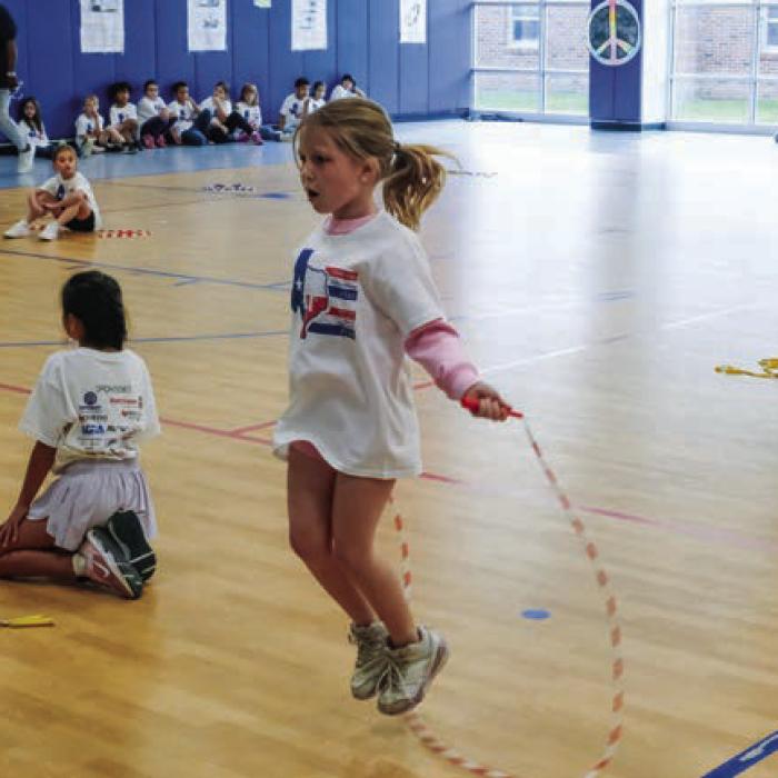 Classmates cheer on the final three girl contestants in the Jump-a-Thon contest Friday morning. Second graders competed to see who could jump rope the longest without making a mistake.