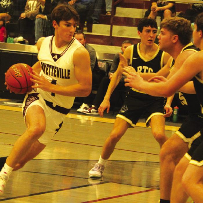 Fayetteville’s Jack Schley drives to the basket in Friday’s game against Round Top-Carmine. Photo by Jeff Wick