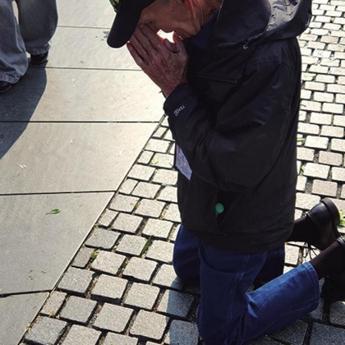 Brown is pictured here as he dropped to his knees, overcome with emotion, as he read the names of the men he served with on the Vietnam Wall.