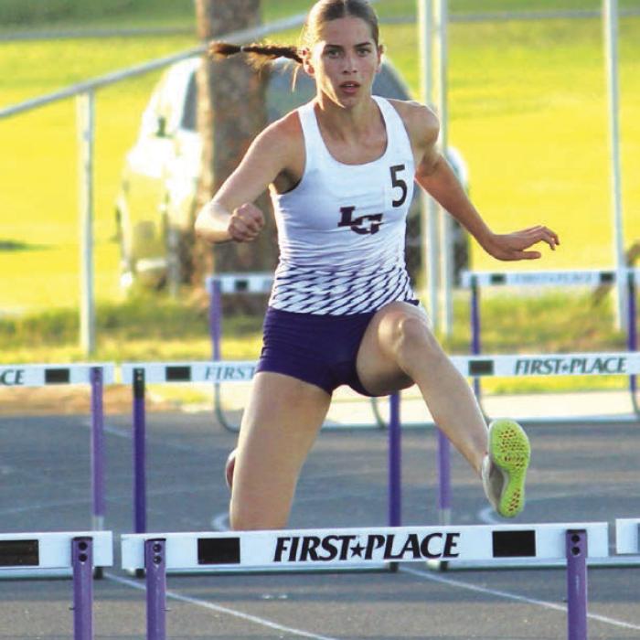La Grange’s Macie Collier stayed undefeated this season in the 300 hurdles with a win at area. Photo by Jeff Wick