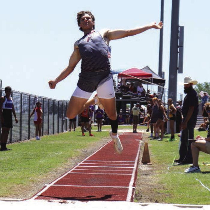 Fayetteville Jack Schley soared to area titles in the long jump and the triple jump. Photo by Ann Pape