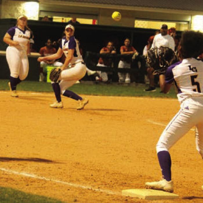 Avery Marshall fires a throw to first on a Caldwell bunt attempt in the 8th inning Monday. Photos by Jeff Wick