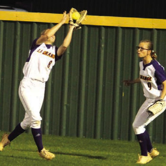 La Grange’s Haylie Cooper catches a ball in the outfield Monday as her sister Haedyn backs up in the play.