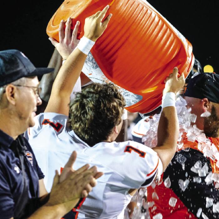 Shorthorns shower their head coach, Luke Hobbs, with a cooler full of ice following their win against Three Rivers Friday night. More on the game on Page B3 today. Photo by Andy Behlen