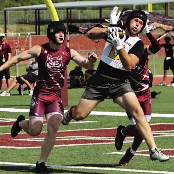 Oliver Gunn from La Grange’s hauls in this pass in Wimberley. Photo by Darrell D. Gest