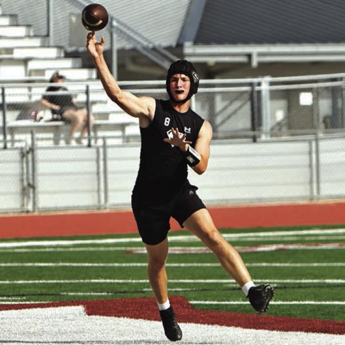 Schulenburg quarterback Owen Brenek passes the ball in Wimberley. Photo by Darrell D. Gest