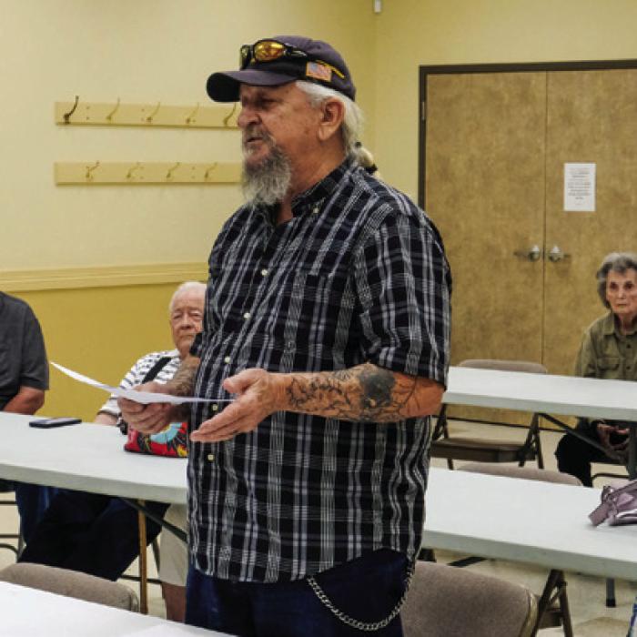 Jerry Moerbe of Nelsonville, pictured above, was part of a group of about 14 area citizens concerned about possible groundwater pollution from the Fayette Power Project who attended the Fayette County Groundwater Conservation District board meeting on Monday. Moerbe said he wants the District to step up groundwater monitoring. FCGCD General Manager David Van Dresar, pictured below, told the crowd that the District is prepared to launch a monitoring campaign. Photos by Andy Behlen