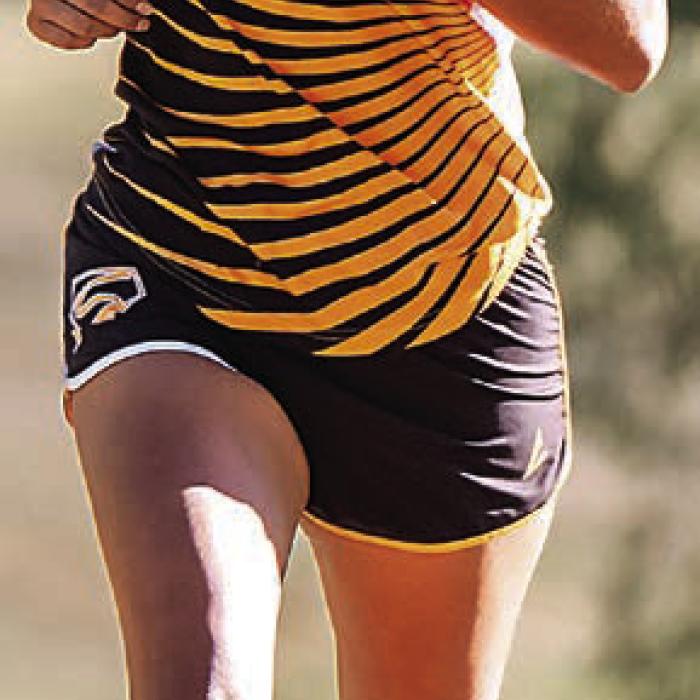 Schulenburg’s Ruby Rodriguez runs her way to the district cross country title Monday in Shiner. Photo by Stephanie Steinhauser