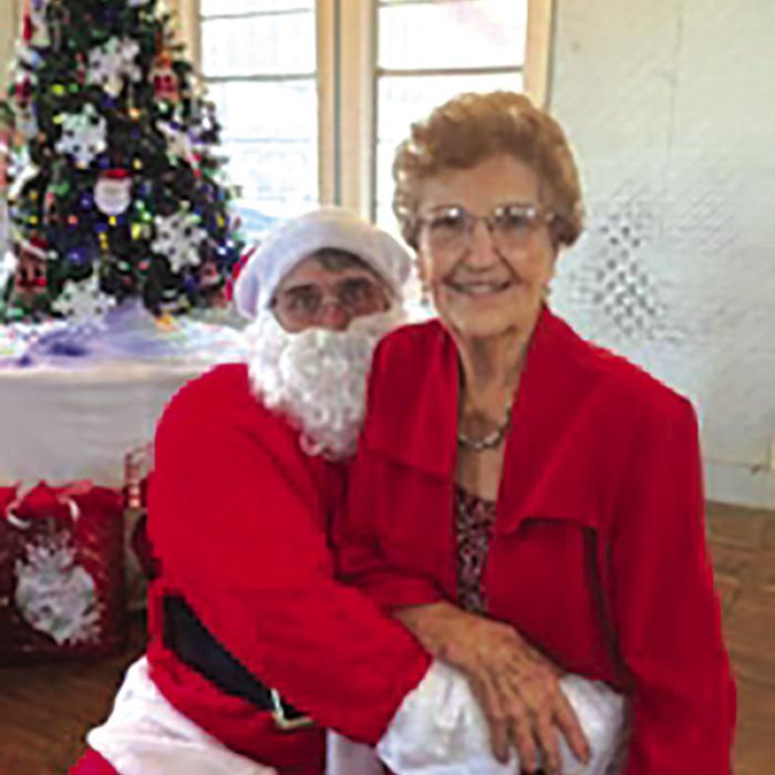 Oldest Attendee at Stavinoha Family Christmas Reunion Sits in Santa’s Lap