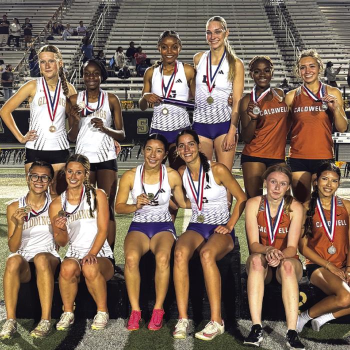The members of the La Grange 4x400 relay pose atop the medal stand after winning their race Thursday on Giddings. The members of that relay are Diamond McKenzie, Kylie Trlicek, Landri Hernandez and Macie Collier.