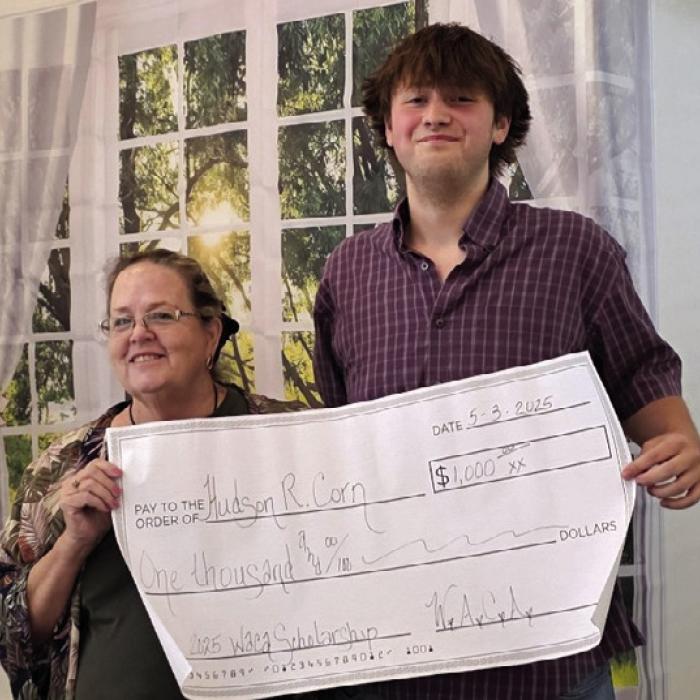 Hudson Corn receives a WACA $1,000 scholarship for the next school year where he plans to attend UTSA to study cyber-security.