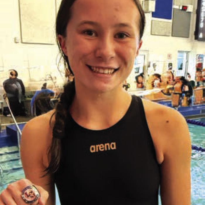 Senior Eleanor Carey lowered her own 50-yard freestyle school record—originally set early last season.