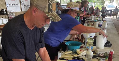 The Ellinger Chamber of Commerce hosted the 86th Annual Ellinger Tomato Festival this past weekend. Festivities included a “Chopped” cooking competition. Pictured above is a scene from the final round on Saturday, May 27. Team “Tropical Mushrooms” won the competition. Team members were John LeBlue and Kelly Vitek, pictured above. Photo by Andy Behlen