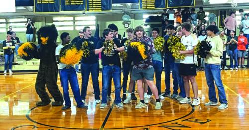 The male RTC athletes grabbed pom-poms and led a cheer for the team during the pep rally.