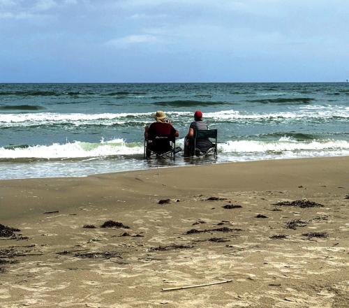 My mom and dad enjoying a day at the beach on Mustang Island. Photo by Adam Behlen