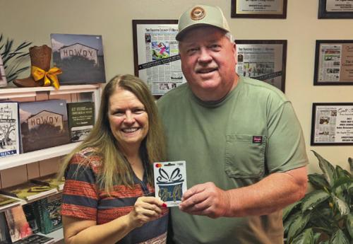 Donald Bertsch was the winner in last week’s reader football contest, not only picking all 10 winners but beating out five other perfect ballots in the score prediction tiebreaker. He is shown above accepting his $100 from Record publisher Regina Keilers.