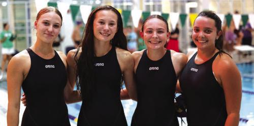 The relay team of (from left) Paige Michalke, Eleanor Carey, Adysen Janacek and Celeine Fabre etched their names into the record books, clocking in at 1:57.92 in the 200-yard freestyle relay. Photo by Katy Michalke