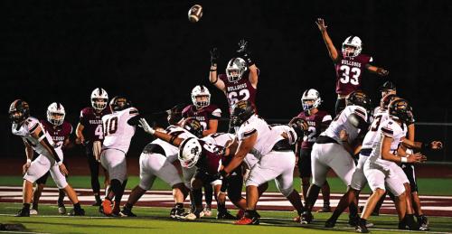 Flatonia players jump to try to block a Schulenburg extra point Friday. Photo by Stephanie Steinhauser