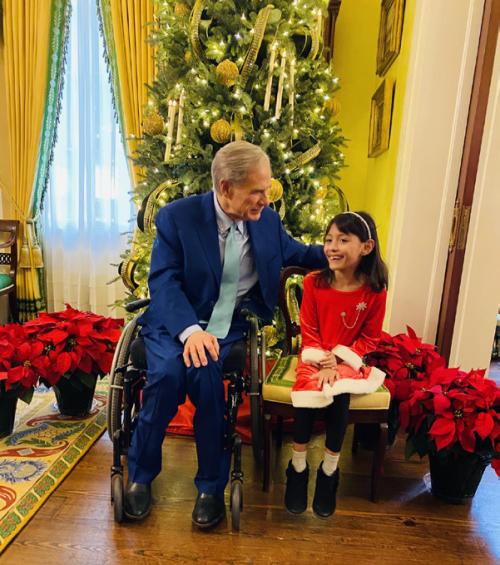 Governor Greg Abbott visits with Reeanna Ramirez, a secondgrader at Sacred Heart School, during a visit to the Governor’s Mansion with her uncle Michael Schlabach last Friday.
