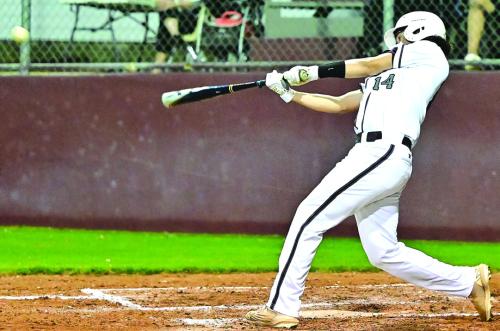 Raymond Toro hits to deep center for a triple in Monday’s game against Gonzales. The Bulldogs pulled out a convincing win for the home crowd. Photos by Stephanie Steinhauser