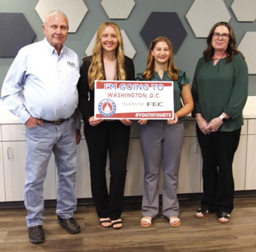 FEC Board President Joseph Kruppa, left, and FEC Youth Tour Coordinator Tracy Denton, right, congratulate Laney Bludau, from Hallettsville High School, and Gretchen Sacks from Round Top-Carmine High School, winners of FEC’s 2026 Governmentin- Action Youth Tour contest.