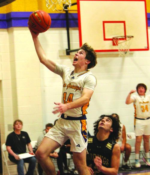 La Grange’s Cordale Knapik drives to the basket for two points Friday. He scored 10. Photos by Jeff Wick