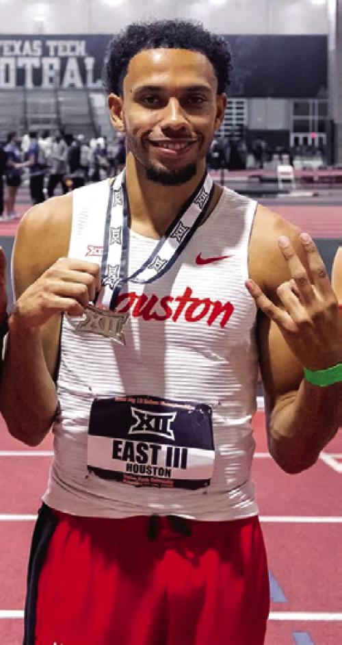La Grange’s Trey East III holds up his 4x400 relay silver medal at the Big 12 Indoor Championships last week in Lubbock.