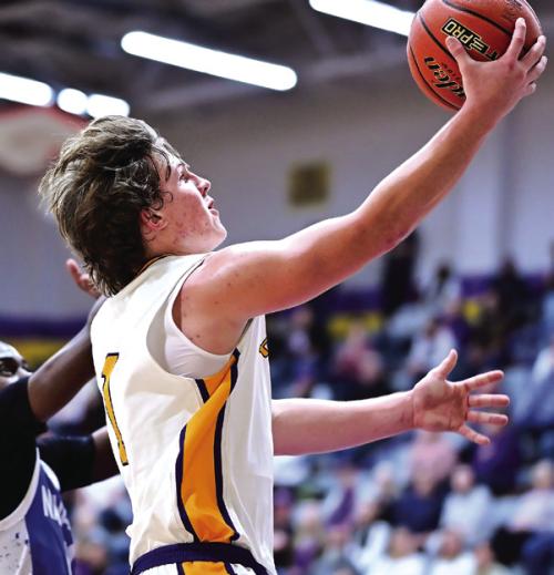 Senior Clayton Cooper goes up for a lay up for La Grange in Friday night’s win over Navasota. Photo by Stephanie Steinhauser