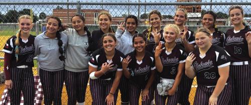 The members of the Flatonia softball team celebrate their Area series-clinching victory Friday in Beeville.