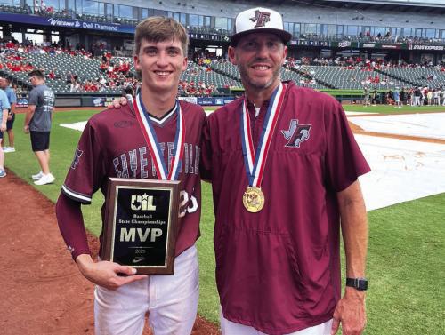 Fayetteville senior shortstop Easton Jaeger, left, poses with his dad, Clint, the head coach of the Lions, after they won the state title Saturday in Round Rock. Photo by Jeff Wick