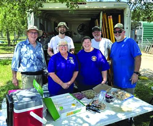 Phyllis Valchar, Grace Lebeda, and representatives from Fayette County Habitat for Humanity.