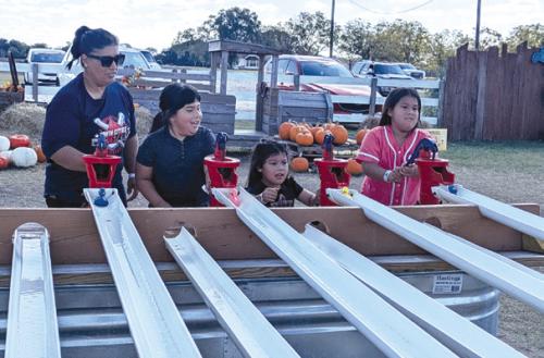 A Turtle Wing family enjoys fun games at Rock Creek Corn Maze.