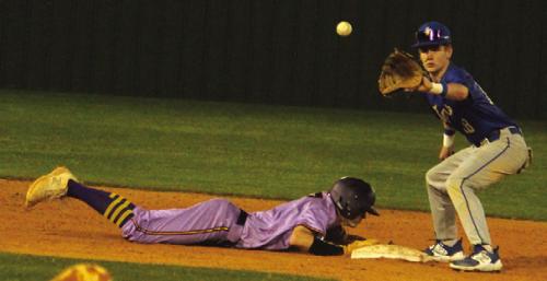 La Grange’s Brayden Horton slides back into second on a pickoff attempt Tuesday. He would later score the game-tying run. Photo by Jeff Wick