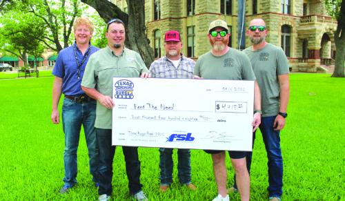 Director of The Texas Burger Bash Tim Scarborough, front, right, presents a check to Jonah Beyer founder of Feed the Need. Back row, left to right: Director of the La Grange Feed the Need program Jeremy Finch and Sam Tucker and Kevin Ulrich of the Texas Burger Bash.