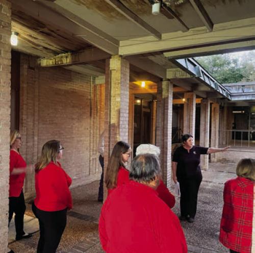 Joanna Prihoda of Cutright and Prihoda Architects discussed renovation options for the canopy over the outside plaza at City Hall with the La Grange City Council on Monday night. Water damage from the leaking roof can be seen at the top of the photograph. Photo by Andy Behlen