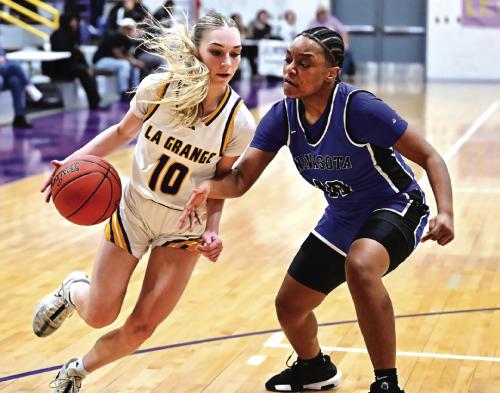 Kylie Trlicek drives in towards the goal for La Grange against some tough defense by Navasota. Photo by Stephanie Steinhauser