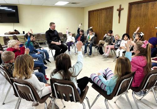 Father Chris Smith spent time with each of the classes talking about vocations and heaven. They contemplated and discussed religious artwork and even played a few games together.