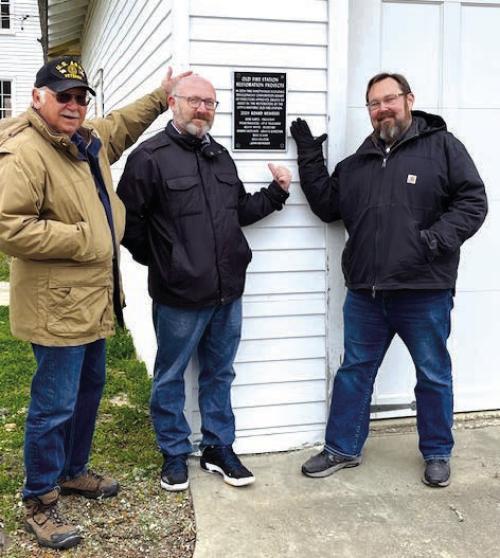 EDC board members Steve Pavlicek, Robbie Hofland and Kevin White in front of plaque commemorating the old fire station restoration projects. Missing board members include Bob Kurtz, Gina Hillock, Mike Clann and John Reynolds.