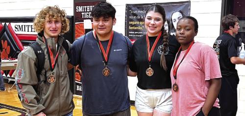 Four of the La Grange High School powerlifters with their medals at the Smithville meet: Left to right, Cody Krupala, Elmer Saldierna, Teagan Branch and Jazzmin Coleman.