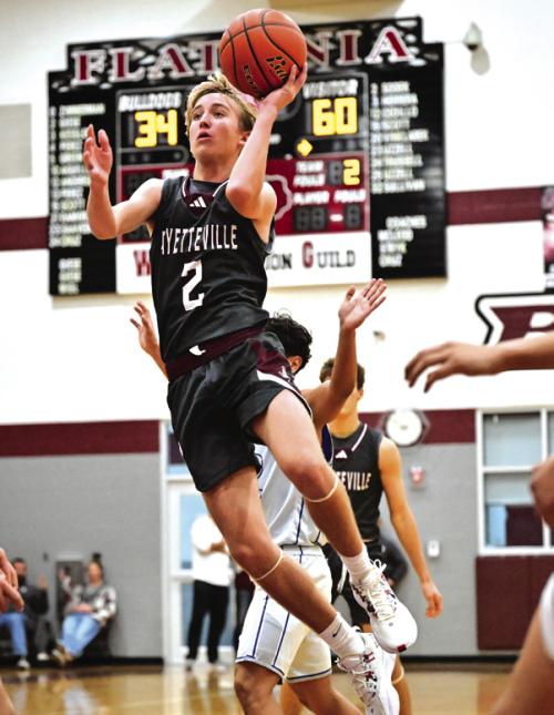 Fayetteville’s Kole Schmitt goes to the bucket in action Friday at the Fayetteville Tournament. The Lions beat Flatonia and Wealder in the tourney but lost twice to Rice Consolidated, including 76-68 in overtime in the tourney title game. Photo by Stephanie Steinhauser