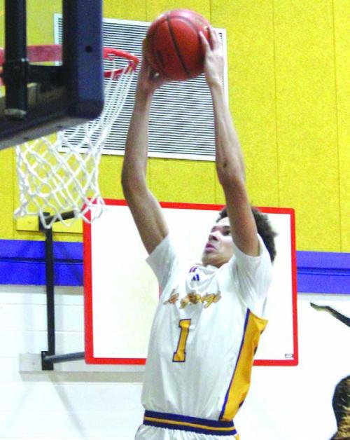 La Grange’s Brandon Mathis, 6-foot-8, goes up for one of his dunks in Friday’s win over Victoria East. Photo by Jeff Wick
