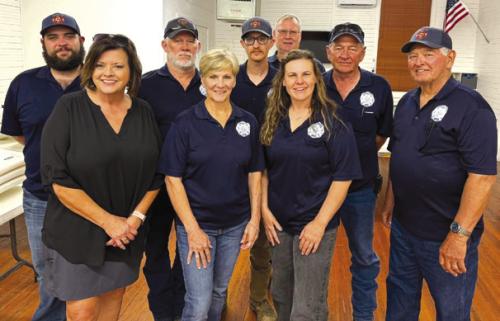 Newly elected Winchester Area Volunteer Fire Department officers from front left: Kelly Franke, Vice President; Sherry Murphy, Treasurer; Jacki Short, President; and Ron Kaiser, Secretary; back row: Nick Brooks, Fire Chief; Melvin Schulze, 2nd Assistant Chief; Ryan McGary, Training Officer; and Barry Zoch, 1st Assistant Chief. Photo bombing the photo is Chuck Breeden, new first responder.
