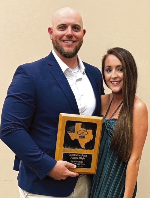 Matthew Miori and his wife Rachel with his award from the Greater Houston Football Coaches Association.