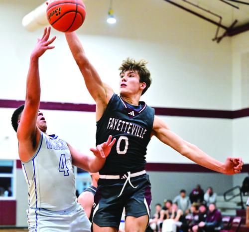 Fayetteville’s Enoch Loafmann blocks a shot in last week’s tournament game against Waelder. Photo by Stephanie Steinhauser
