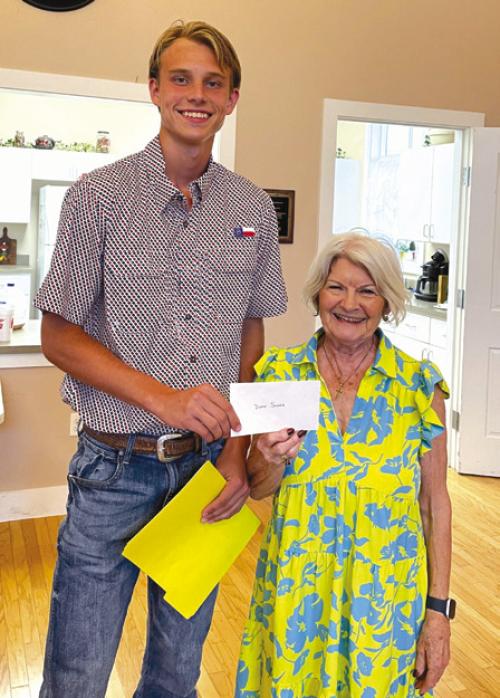 Duke Sodek, Fayette CHS scholarship recipient, receiving a $500 check from CHS President Betty Danner.