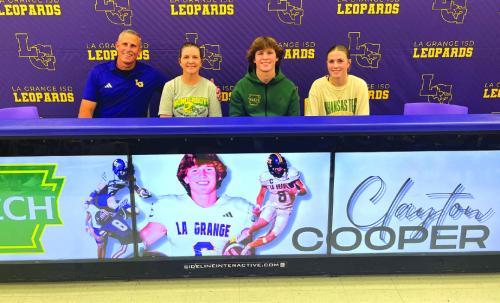 La Grange quarterback Clayton Cooper signed his letter of intent Wednesday to accept a scholarship offer to play football for Arkansas Tech University. He is shown above with his family at his signing ceremony. Left to right: Clayton’s dad and mom Kyle and Ginger Cooper, Clayton, and his sister Campbell. Photo by Jeff Wick