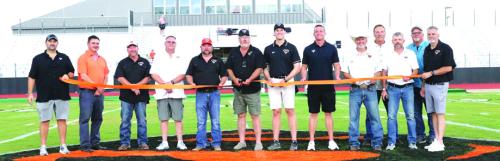 Schulenburg school officials cut a ribbon to dedicate the stadium renovations before Friday’s game. Photo by Audrey Kristynik