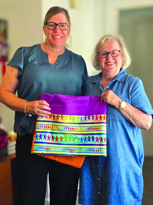Martin Luther Lutheran Church Women of the ELCA Quilting Group presented fleece quilted throws to CASA of Bastrop, Fayette, and Lee Counties for their use. Court Appointed Special Advocates (CASA) improve the lives of children who experience child abuse and neglect in these counties. They train these advocates to support children and families involved in the child welfare system. Pictured are Kristi Bauer, left, Executive Director of CASA, and Leonita Sanders, coordinator of the MLLC WELCA unit.